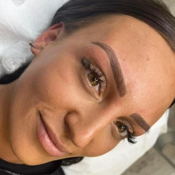 Defined ombré brows on a client after treatment